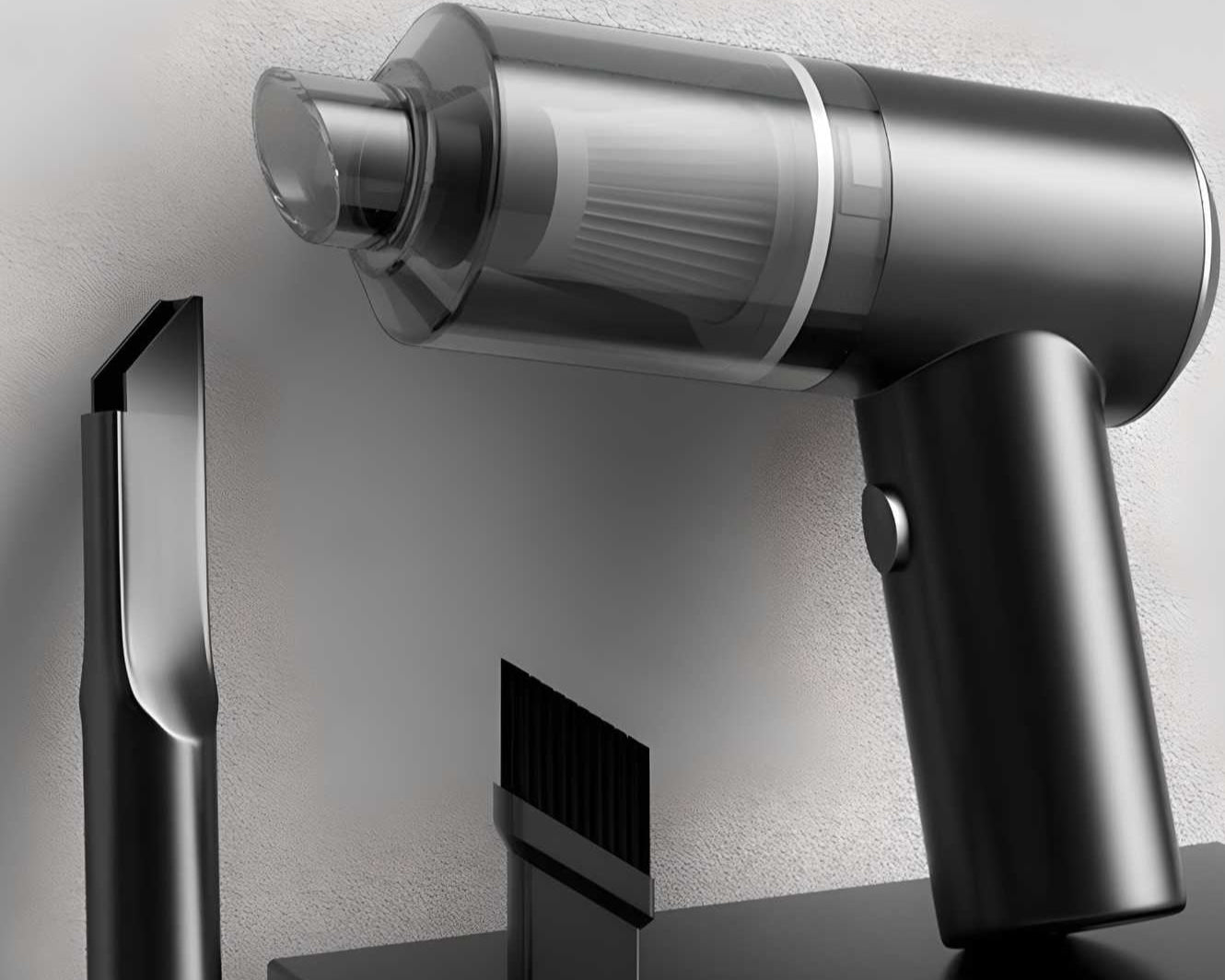 Black and silver handheld vacuum cleaner with attachments on a light gray background